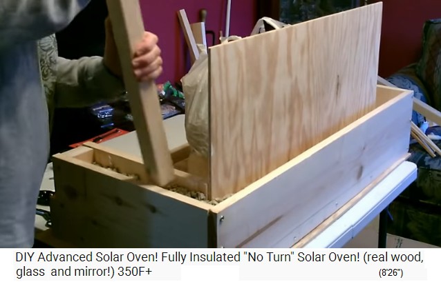 The green fiber insulation is compressed
                  with a stick