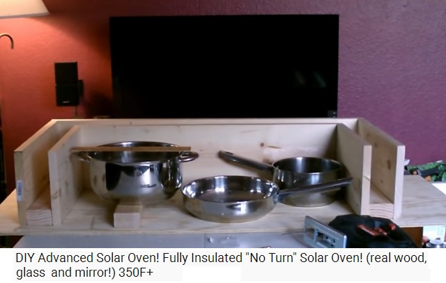 The frame of the solar oven with 3 large pots