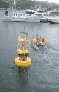 Power buoy from OPT during a
                                    test run in the port of Seattle