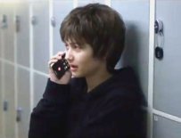 Trans victim Jaily with mobile
                  phone calling for help (actor)