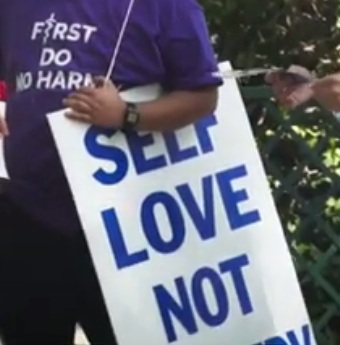 Poster against trans
                    madness: "Self love not surgery"