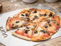 Pizza Napoli with anchovies, olives and capers