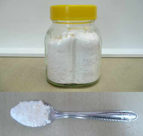 Sodium bicarbonate in a glass and on a
                      tea spoon