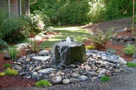 Spring stone with waterfall in the garden