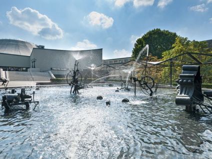 Fountain as a shower:
                    Tinguely Fountain in Basel, Switzerland 02