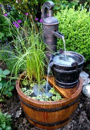 Garden fountain with water pump, kettle
                    and tub