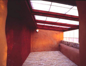 Walipini: Greenhouse half sunken in an
                            embankment with earth brick soil