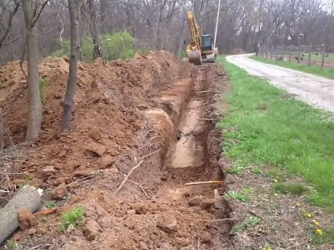 Trabajos con excavadora
                              01 para una fosa general