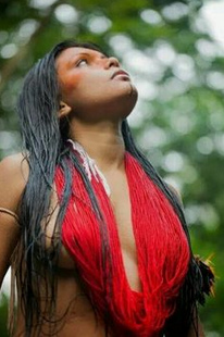 Woman topless in Amazon jungle with necklaces