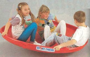 Gonge round seesaw 04
                            with 3 children in it, Sport Thieme GmbH,
                            Grasleben, Germany