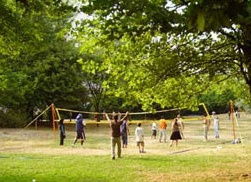 Volleyball on a lawn in the park at
                                Dammweg in Berlin-Neukoelln