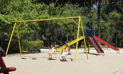 Group of swings 05 in "Country
                                House Park" (parque Quinta Normal),
                                Santiago in Chile