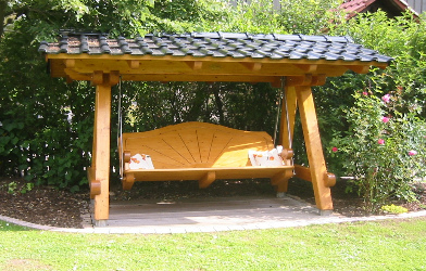 Hollywood swing made of
                            wood