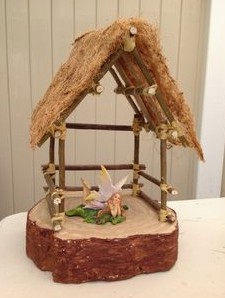 Toy house with bamboo
                  structure with straw roof made of coconut fiber