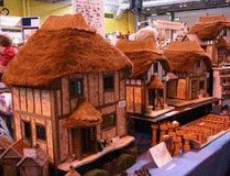 Model houses with straw roofs made of
                  coconut fiber