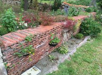 Dry
                stone wall made of old roof tiles