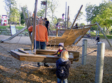 Little swing boat in Herminghaus Park
                            in Velbert (region of Wuppertal), Germany